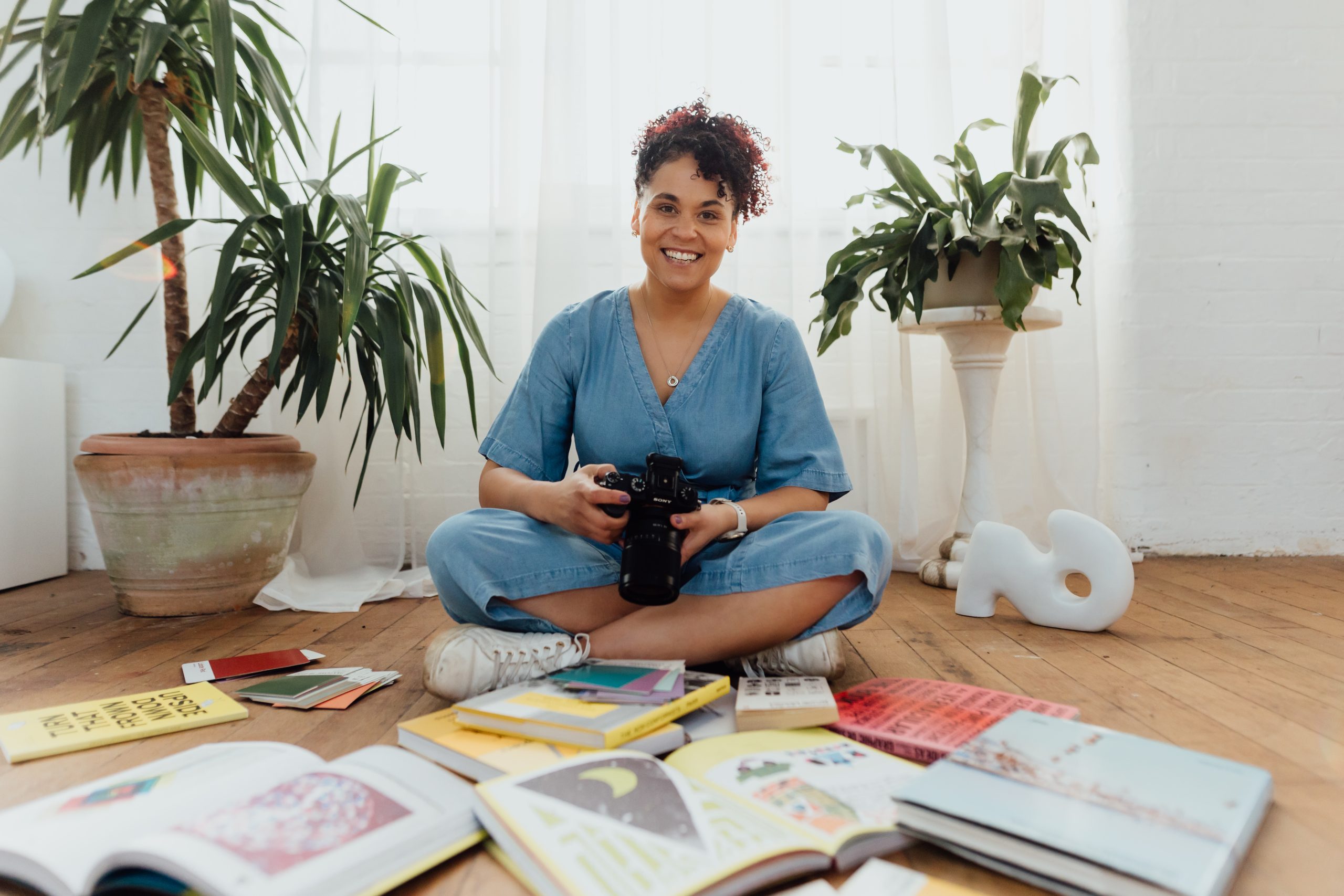 Artist standing in doorway of shop
